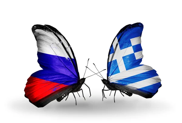 Due farfalle con bandiere di Russia e Grecia su ali — Foto Stock
