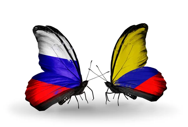 2 匹の蝶翼にロシアやコロンビアの旗 — ストック写真