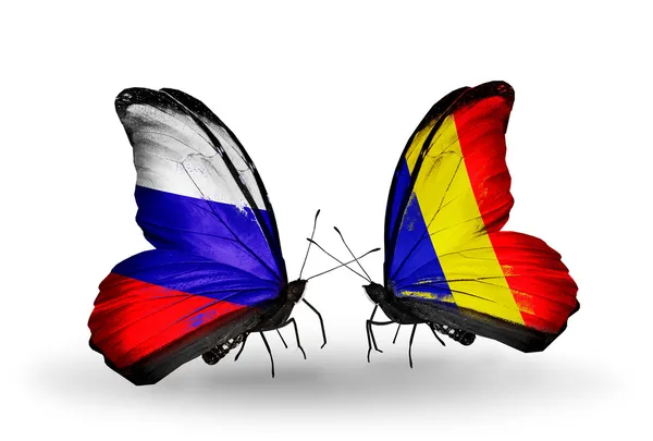 Deux papillons avec des drapeaux de la Russie et du Tchad, Roumanie sur les ailes — Photo