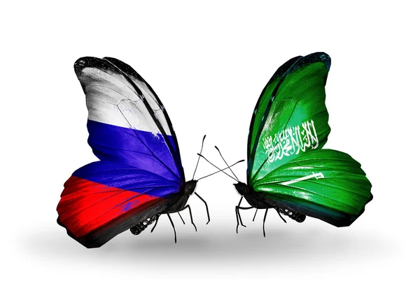 Twee vlinders met vlaggen van Rusland en Saoedi-Arabië op vleugels — Stockfoto