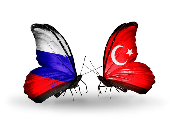 Due farfalle con le bandiere di Russia e Turchia sulle ali — Foto Stock