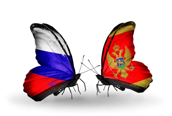 Due farfalle con le bandiere di Russia e Montenegro sulle ali — Foto Stock