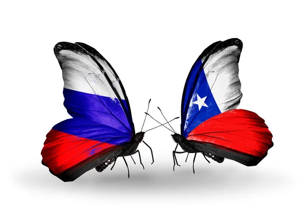Dwa motyle z flagi Rosji i chile na skrzydłach — Zdjęcie stockowe