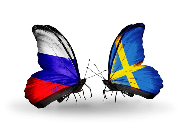 Two butterflies with flags of Russia and Sweden on wings — Stock Photo, Image