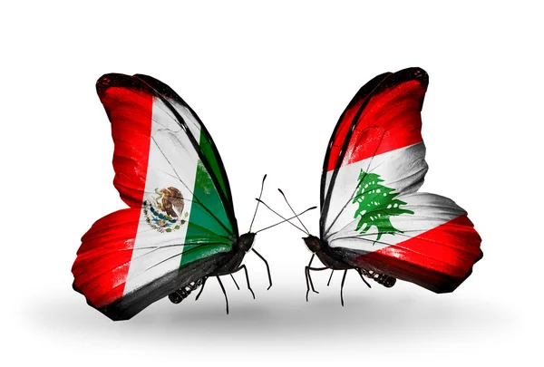 Dos mariposas con banderas de México y Líbano en alas — Foto de Stock