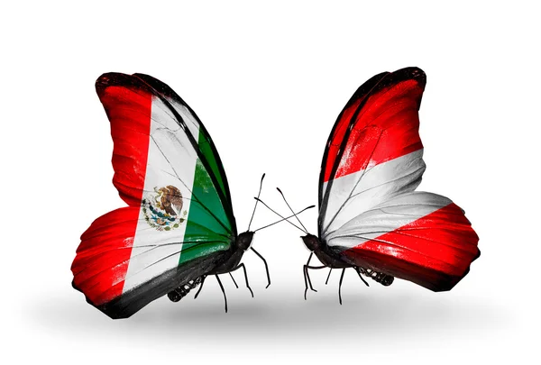 Dwa motyle z flagami Meksyk i Austrii na skrzydłach — Zdjęcie stockowe
