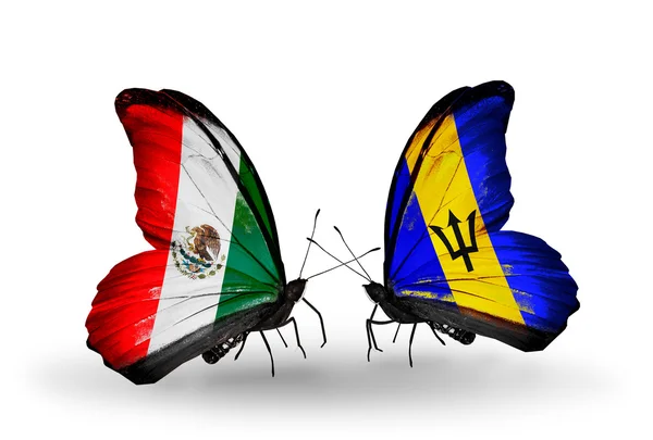 Две бабочки с флагами Мексики и Барбадоса на крыльях — стоковое фото