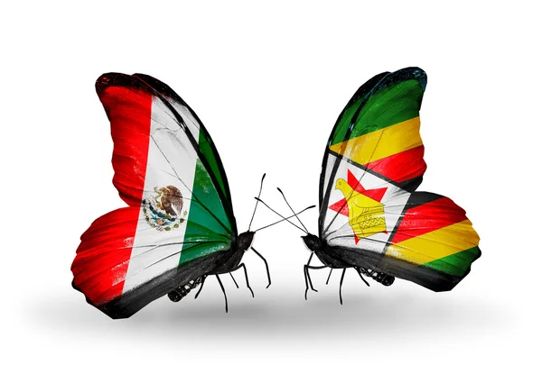 Dos mariposas con banderas de México y Zimbabwe en alas —  Fotos de Stock