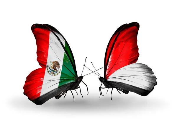 Dos mariposas con banderas de México y Mónaco, Indonesia en alas — Foto de Stock
