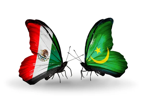 Dva motýli s vlajkami Mexika a Mauritánie na křídlech — Stock fotografie