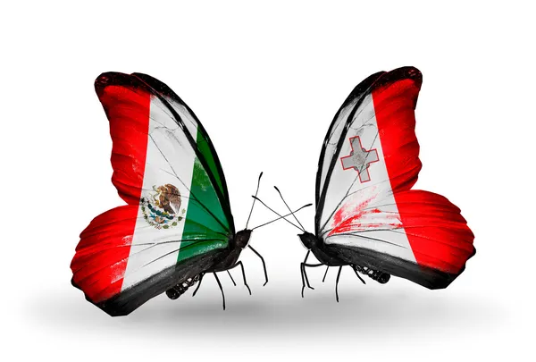 Due farfalle con le bandiere del Messico e Malta sulle ali — Foto Stock