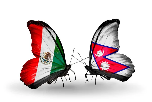 Zwei Schmetterlinge mit mexikanischen und nepalesischen Flaggen auf Flügeln — Stockfoto