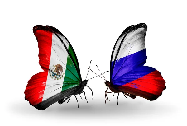 Two butterflies with flags of Mexico and Russia on wings — Stock Photo, Image