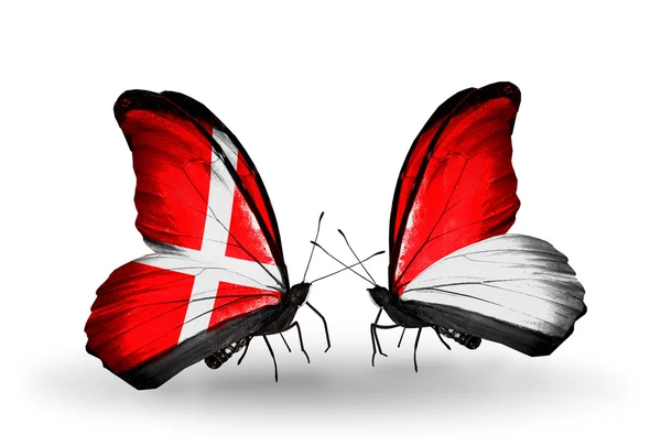 Two butterflies with flags of Denmark and Monaco, Indonesia on wings — Stock Photo, Image