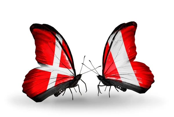 Two butterflies with flags of Denmark and Peru on wings — Stock Photo, Image