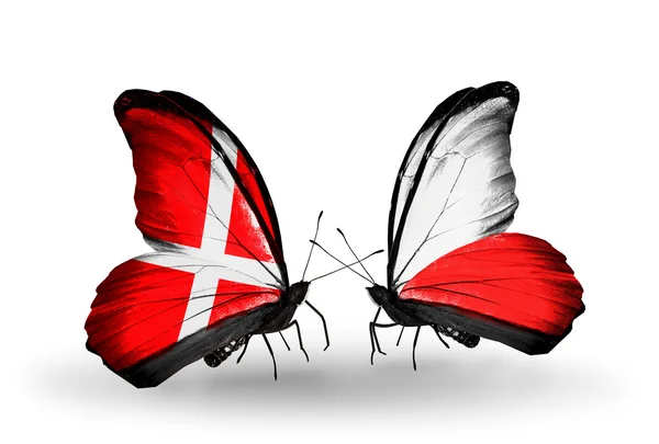 Two butterflies with flags of Denmark and Poland on wings — Stock Photo, Image