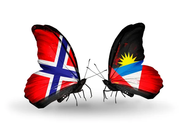 Butterflies with Norway and Antigua and Barbuda flags — Stock Photo, Image