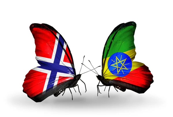 Mariposas con banderas de Noruega y Etiopía en alas — Foto de Stock