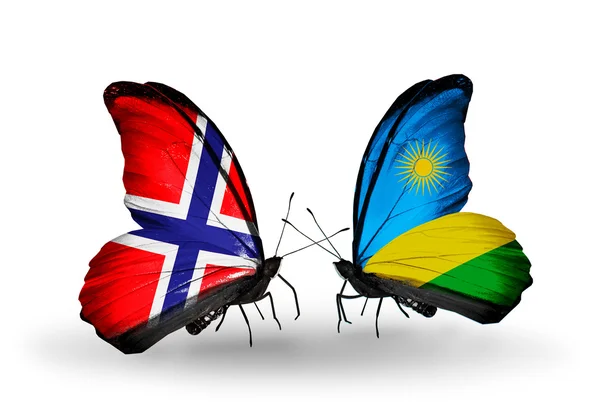 Schmetterlinge mit norwegischen und ruandischen Flaggen auf Flügeln — Stockfoto