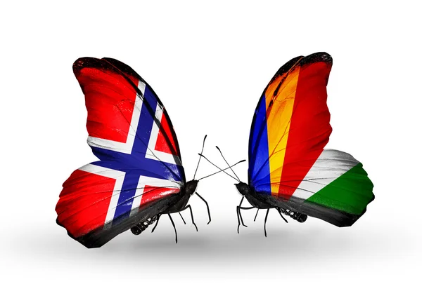 Schmetterlinge mit Norweger- und Seychellen-Flaggen auf Flügeln — Stockfoto