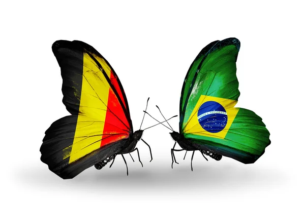 Schmetterlinge mit belgischen und brasilianischen Flaggen auf Flügeln — Stockfoto