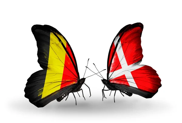 Butterflies with Belgium and Denmark flags on wings — Stock Photo, Image