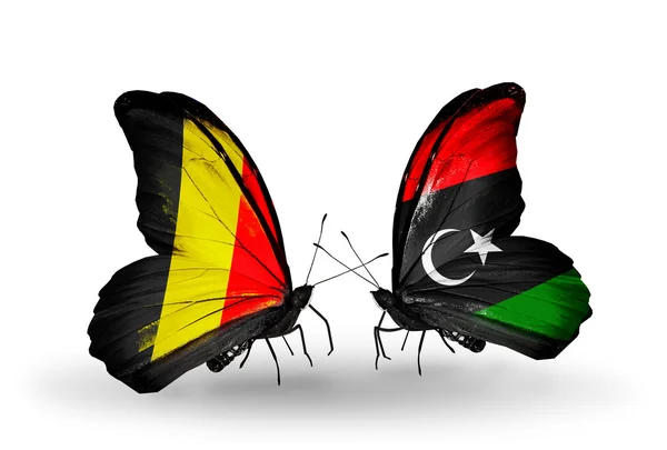 Mariposas con banderas de Bélgica y Libia en alas — Foto de Stock