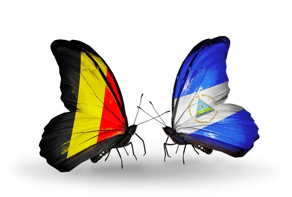 Butterflies with Belgium and Nicaragua flags on wings — Stock Photo, Image