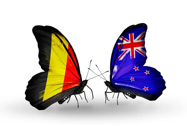 Butterflies with Belgium and New Zealand flags on wings — Stock Photo, Image
