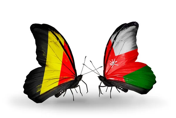 Fjärilar med Belgien och oman flaggor på vingar — Stockfoto