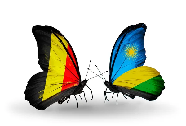Farfalle con bandiere Belgio e Ruanda sulle ali — Foto Stock
