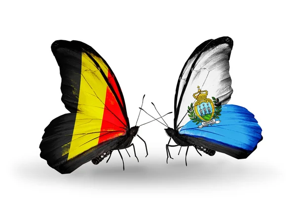 Butterflies with Belgium and San Marino flags on wings — Stock Photo, Image