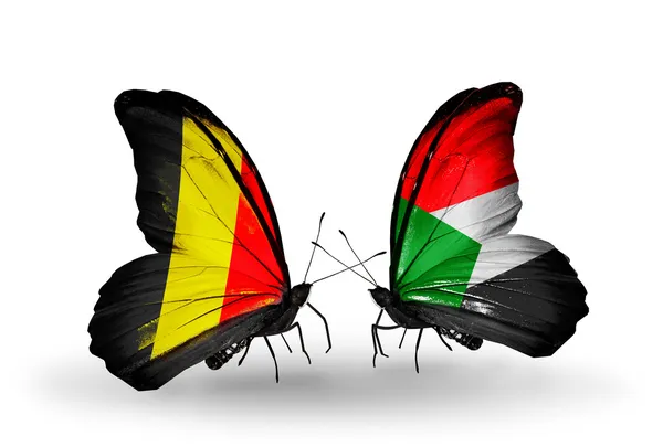 Borboletas com bandeiras da Bélgica e do Sudão em asas — Fotografia de Stock