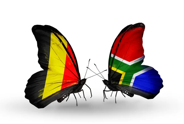 Butterflies with flags Belgium and South Africa on wings — Stock Photo, Image