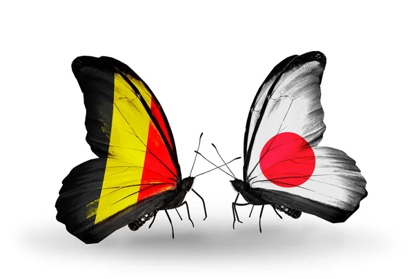 Butterflies with Belgium and Japan flags on wings — Stock Photo, Image