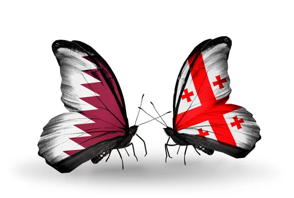 Kelebek kanatları üzerinde Katar ve Gürcistan bayraklı — Stok fotoğraf