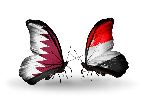 Butterflies with Qatar and Yemen flags on wings — Stock Photo, Image