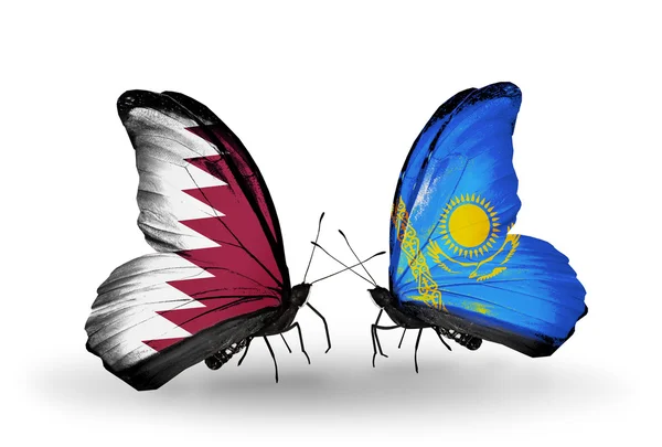 蝴蝶翅膀上的卡塔尔和哈萨克斯坦标志 — 图库照片