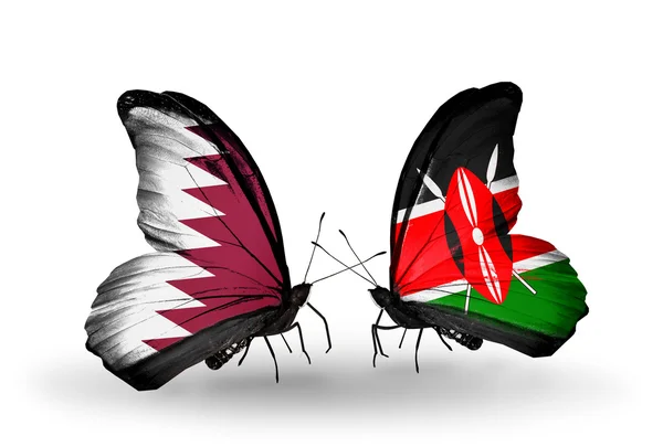 Papillons avec drapeaux Qatar et Kenya sur les ailes — Photo