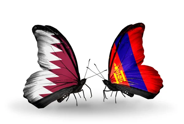 Papillons avec drapeaux Qatar et Mongolie sur les ailes — Photo