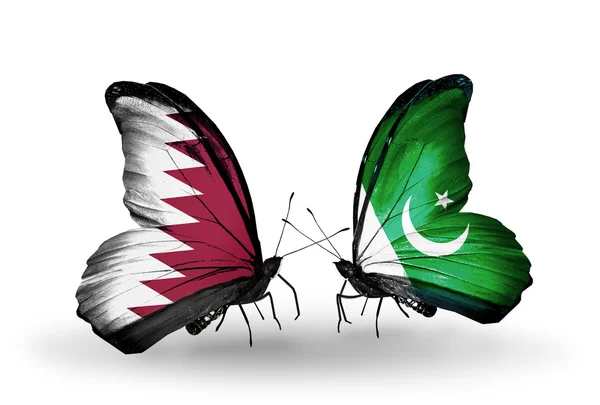 Butterflies with Qatar and Pakistan flags on wings — Stock Photo, Image