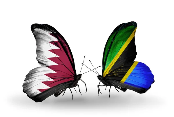 翼にカタールとタンザニアのフラグと蝶 — Stock fotografie