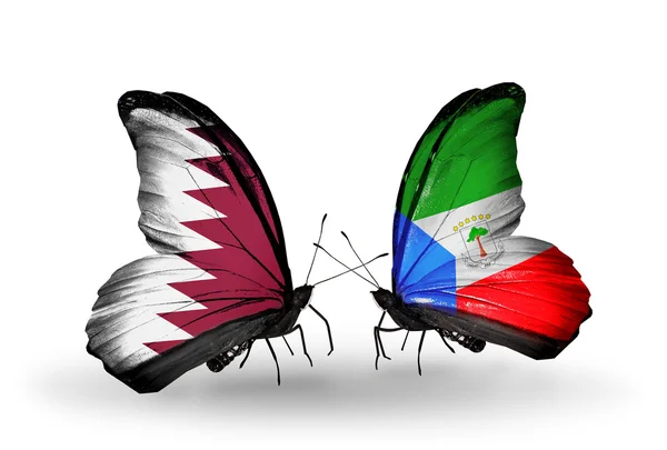 Butterflies with Qatar and Equatorial Guinea flags on wings — Stock Photo, Image