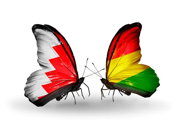 Pillangók szárnyain Bahrein és Bolívia zászlókkal — Stock Fotó