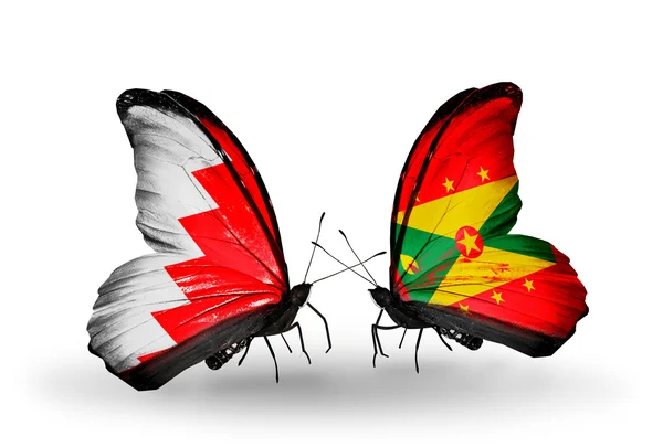 Farfalle con bandiere Bahrain e Grenada sulle ali — Foto Stock