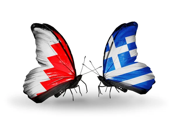 Butterflies with Bahrain and Greece flags on wings — Stock Photo, Image