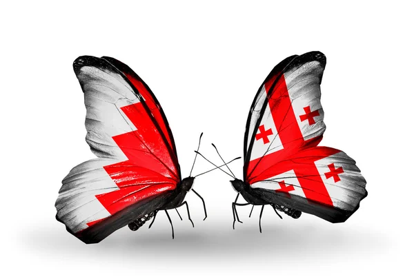 Butterflies with Bahrain and Georgia flags on wings — Stock Photo, Image