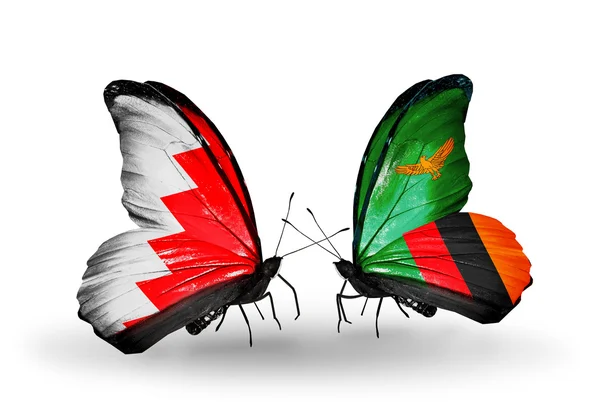 Mariposas con banderas de Bahréin y Zambia en alas — Foto de Stock