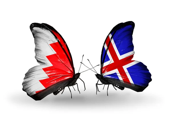 Schmetterlinge mit Bahrain und isländischen Flaggen auf Flügeln — Stockfoto