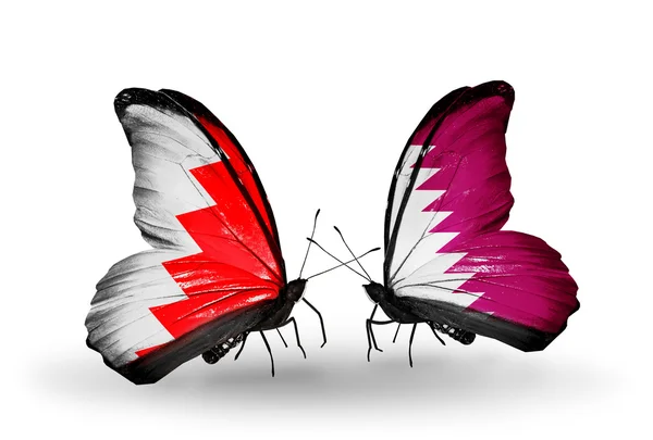 Papillons avec des drapeaux Bahreïn et Qatar sur les ailes — Photo